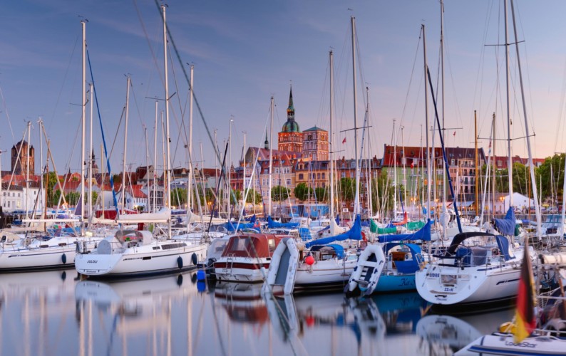 Stralsund, Mecklenburg-Vorpommern, Germany - View across CityMarina Stralsund and hafen with St.Nikolai-Kirche in the background and yachts in the foreground.