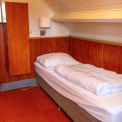 Schlafzimmer für behinderte Menschen im Gruppenhaus ImminkOpkamer in den Niederlanden