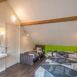 Schlafzimmer im Gruppenhaus De Eek für behinderte Menschen in den Niederlanden